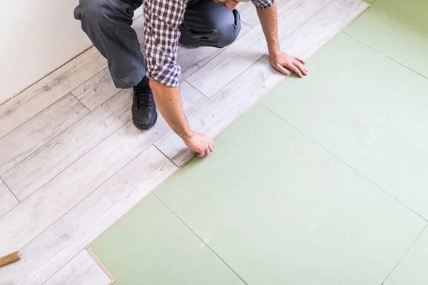 Laminate flooring planks styled in a modern living room