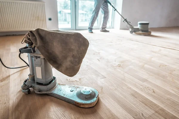 Timber floor being sanded with professional polishing equipment